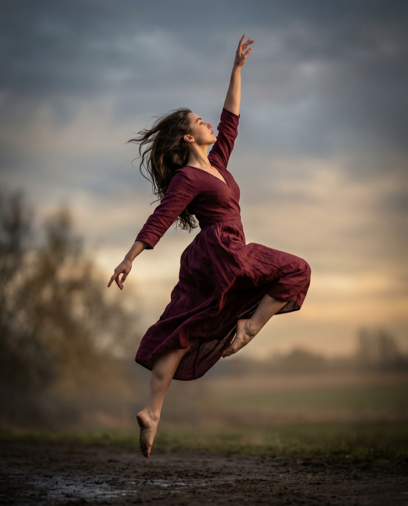 A woman leaping lightly in a burgundy dress — a symbol of returning to a healthy everyday life